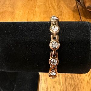 Copper and White Crystal Bracelet, snap clasp. Back is red black and gold